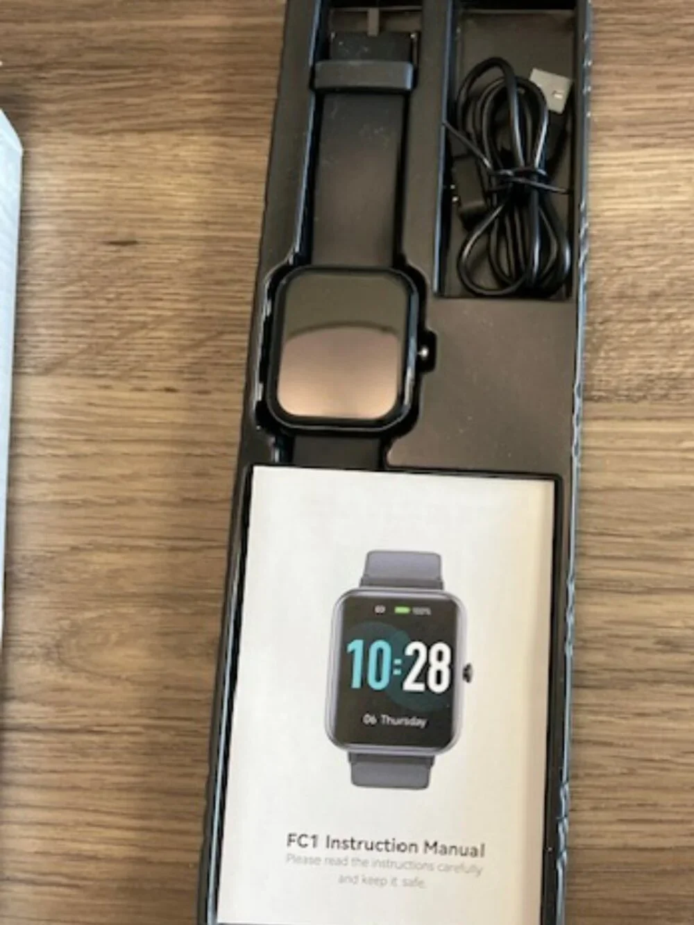 Black Smartwatch with Silicone Band and Color Display